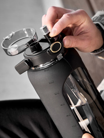 Glass water bottle with silicone sleeve 2 L