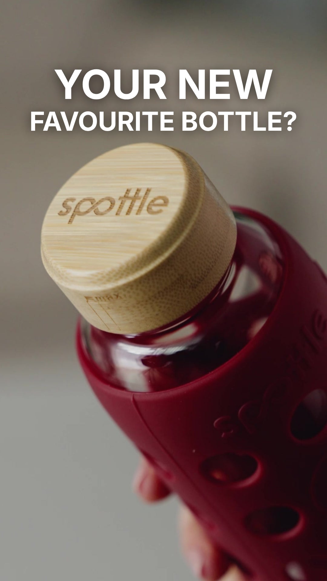 Load video: A spottle glass water bottle with a Berry silicone sleeve is unboxed, filled with water and placed in the dishwasher with the lid removed.