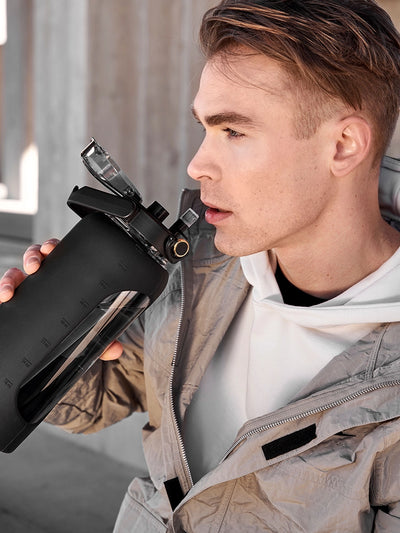 Glass water bottle with silicone sleeve 2 L